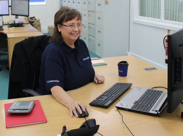 Employee sitting around desk