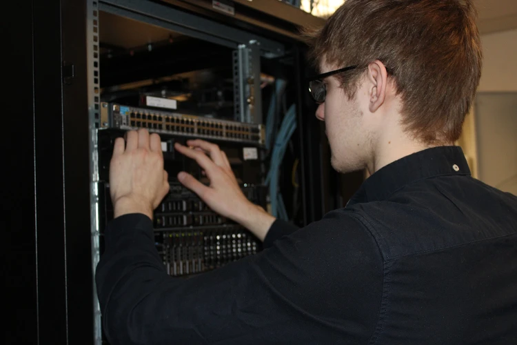 Man fixing server room